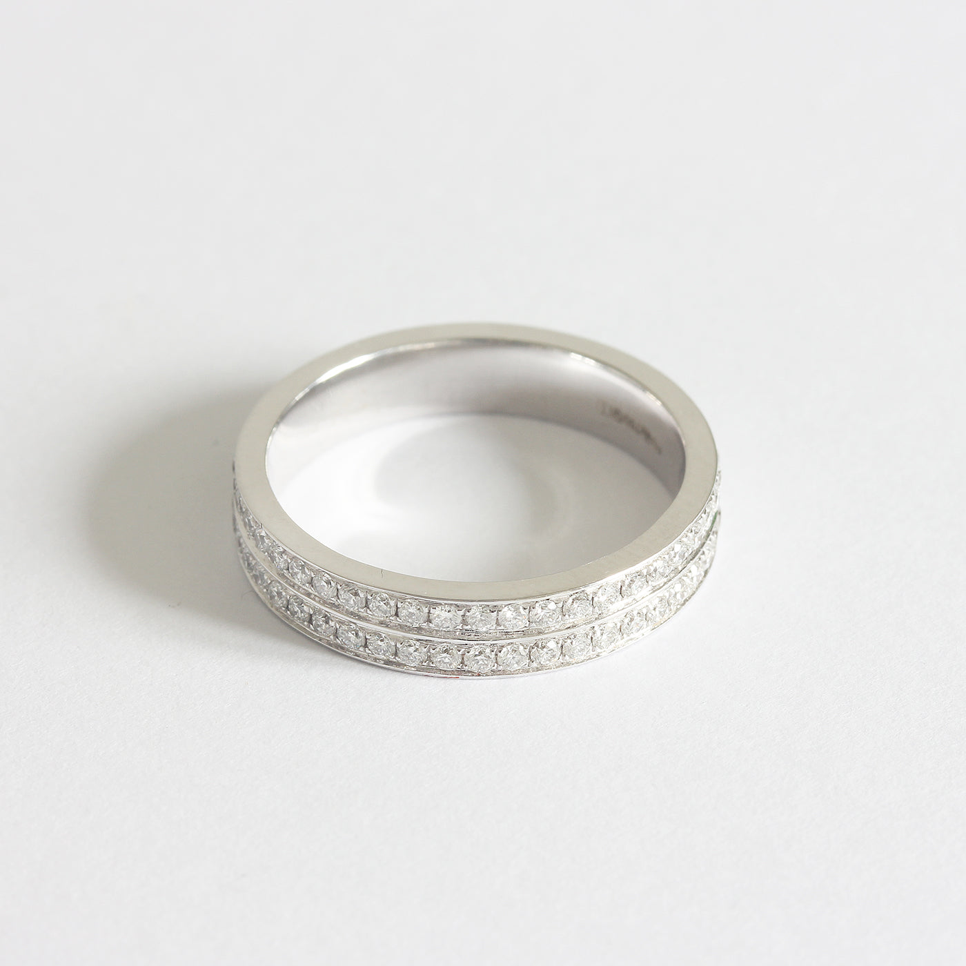 a white gold 2 row diamond set full eternity ring