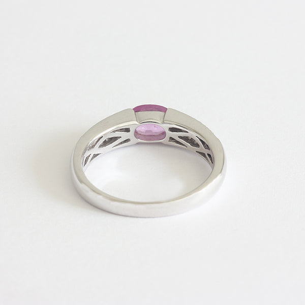 a modern pink sapphire and diamond ring white gold