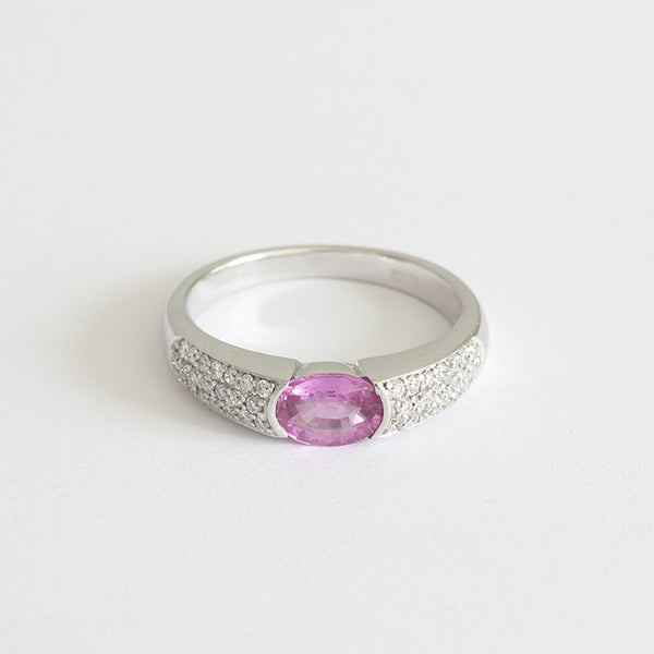 a pretty pink sapphire and diamond ring white gold