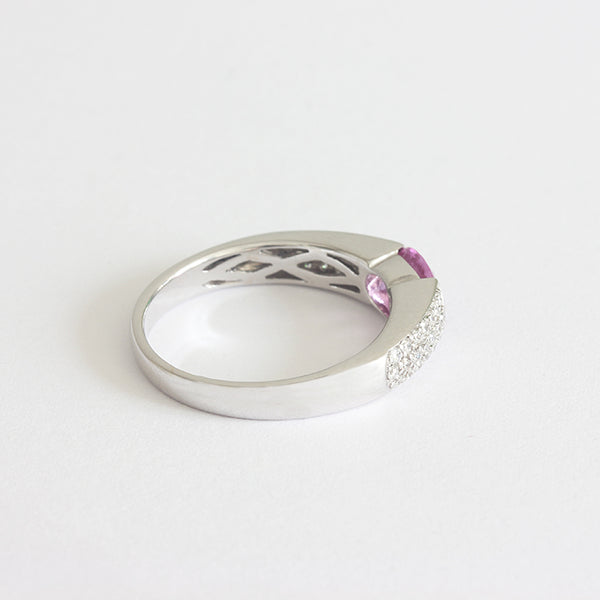 a white gold diamond and pink sapphire ring