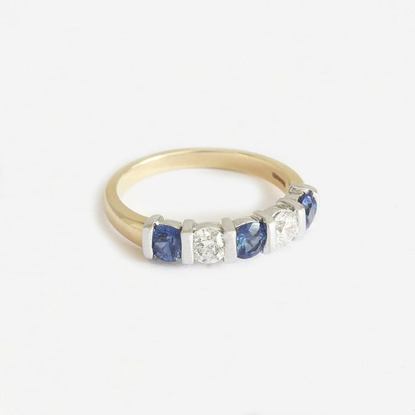 a five stone sapphire and diamond ring in yellow and white gold