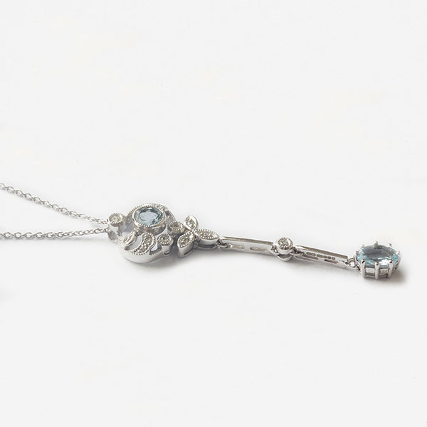 a white gold drop leaf pendant with aquamarine and diamonds