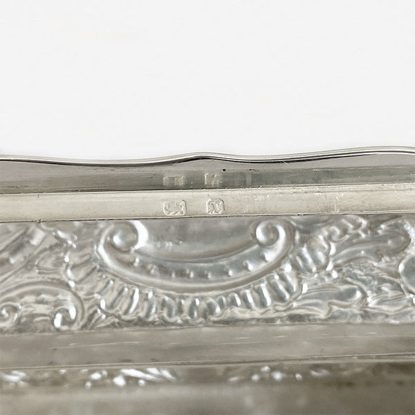 a secondhand silver rectangular small trinket box with floral pattern and initials dated birmingham 1897