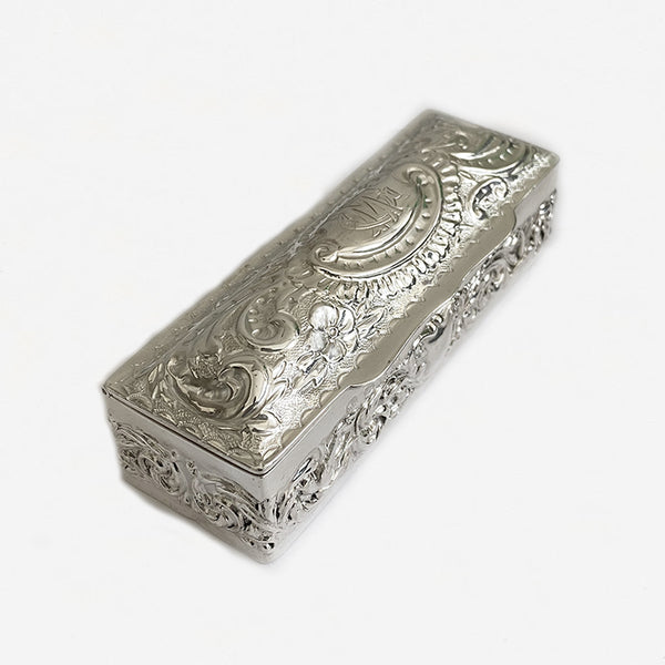 a victorian silver rectangular embossed box with initials and scroll floral design 1897 marston barrett in lewes