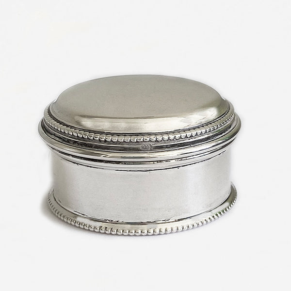 a vintage modern silver little round box with hallmarks and beaded edge dated 2001