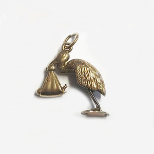 a 9 carat yellow gold stork with baby charm for a bracelet  Edit alt text