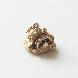 a fine quality secondhand water mill gold charm for a bracelet