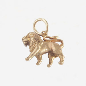 a yellow gold walking lion charm