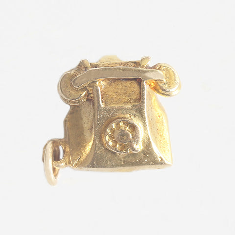 a telephone charm in yellow gold with old-fashioned dial