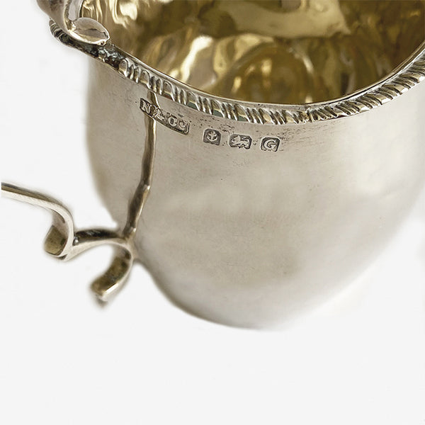 a secondhand vintage silver cream jug with hallmarks for birmingham 1931