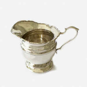 a vintage plain milk jug in solid silver dated Birmingham 1925 at marston barrett in lewes  Edit alt text