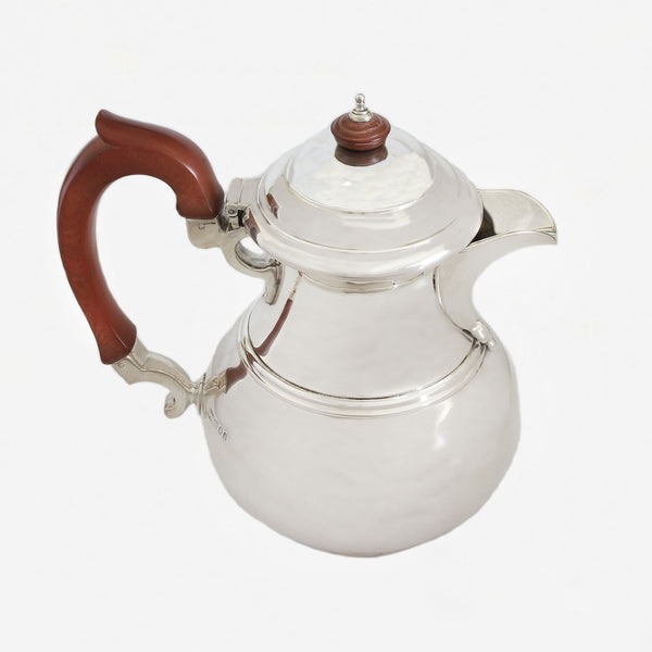 a lovely old silver plain water jug with reeded edges and hallmark for London 1931