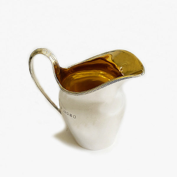 a plain cream jug silver with georgian style dated 1935