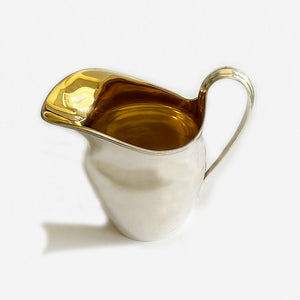 a plain silver cream jug at marston barrett jewellers in lewes dated 1935