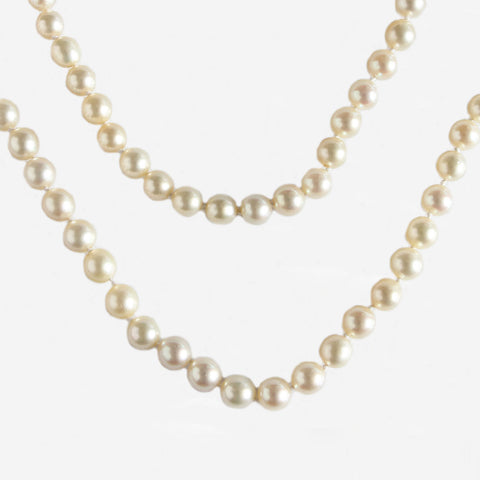 a long single row cultured pearl necklace forty two inches graduated