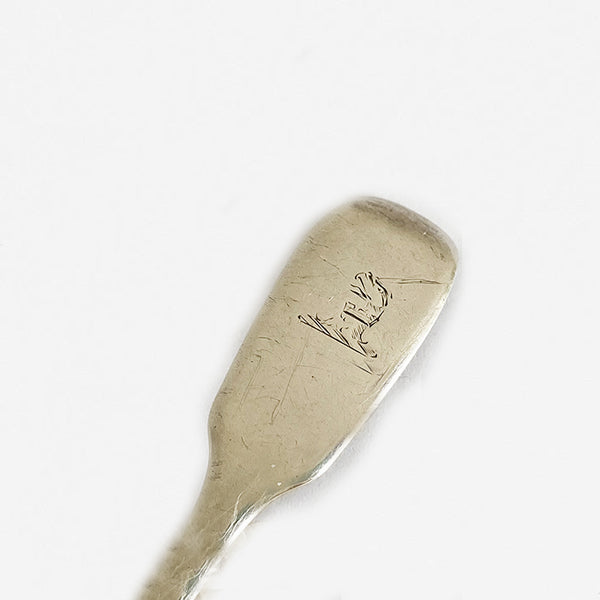 an 1832 solid silver salt spoon with family crest