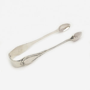 a pair of silver victorian sugar tongs dated 1868