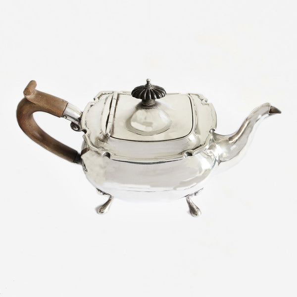 a beautiful silver teapot with wooden handle and dated 1913