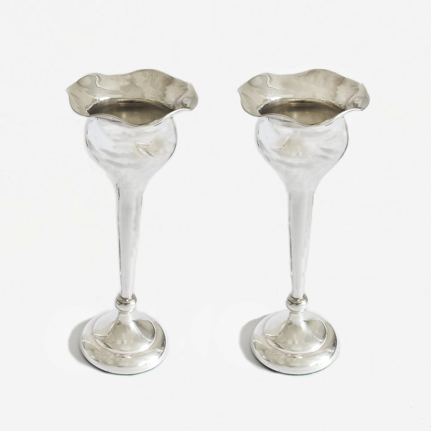 a pair of fluted trumpet vases in silver at Marston barrett