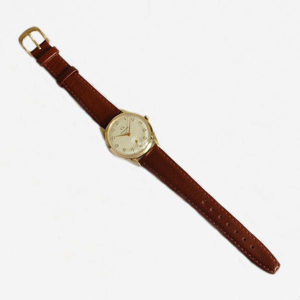 a secondhand garrard gents watch with gold case and leather strap with box