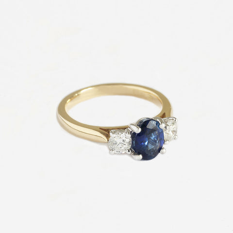 a sapphire and diamond 3 stone claw set ring in 18 carat gold