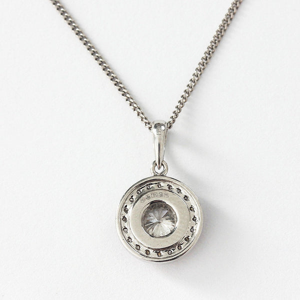 a diamond round cluster pendant in a white gold setting and chain