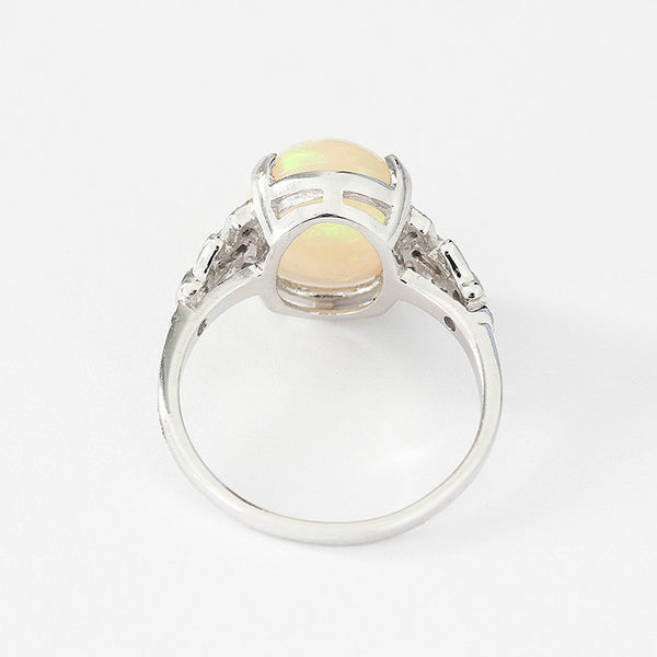 opal and diamond set ring with a white gold band