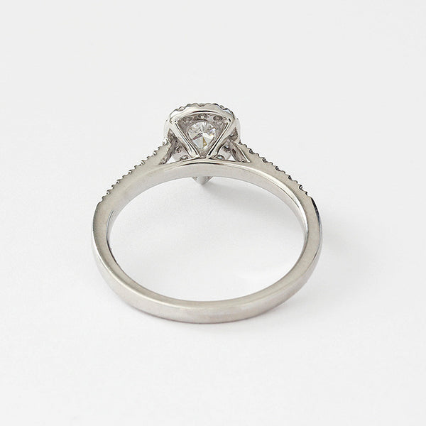 a platinum diamond cluster engagement ring in a claw setting