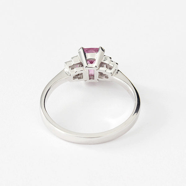 white gold pink sapphire ring with baguette diamond shoulders