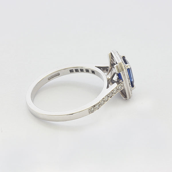 a white gold sapphire and diamond set cluster ring