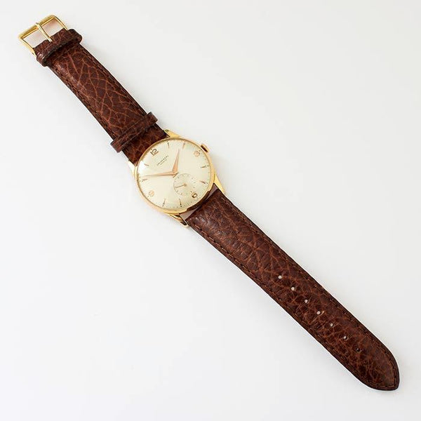 a secondhand preowned universal gents watch with 18ct rose gold case and brown leather strap with 33mm dial